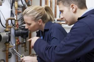 a young woman on a plumbing training