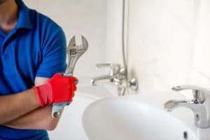 closeup of a plumber in the bathroom