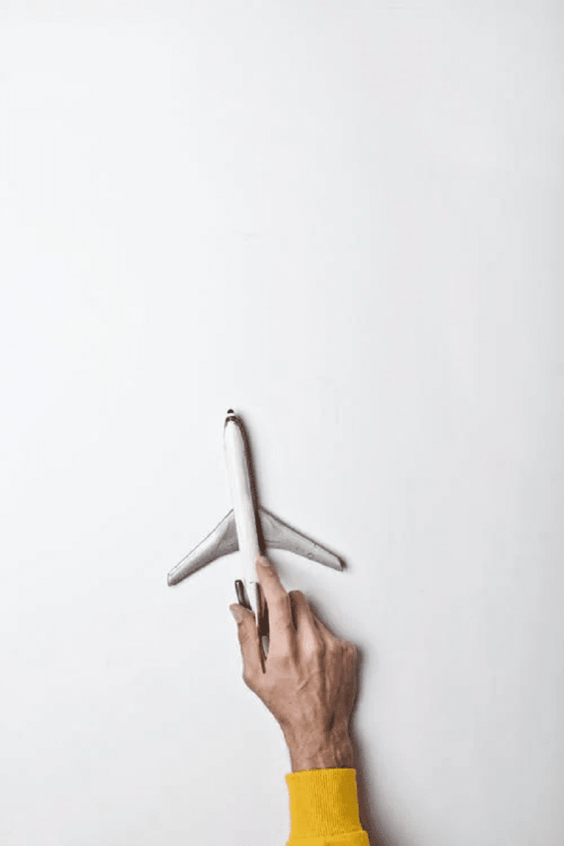 a man Hand on Artificial Airplane