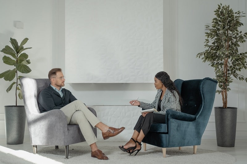 Business Lady interviewing a man