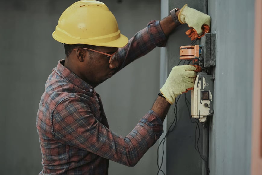 a person working on electrical stuff