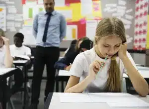 children taking an exam at school