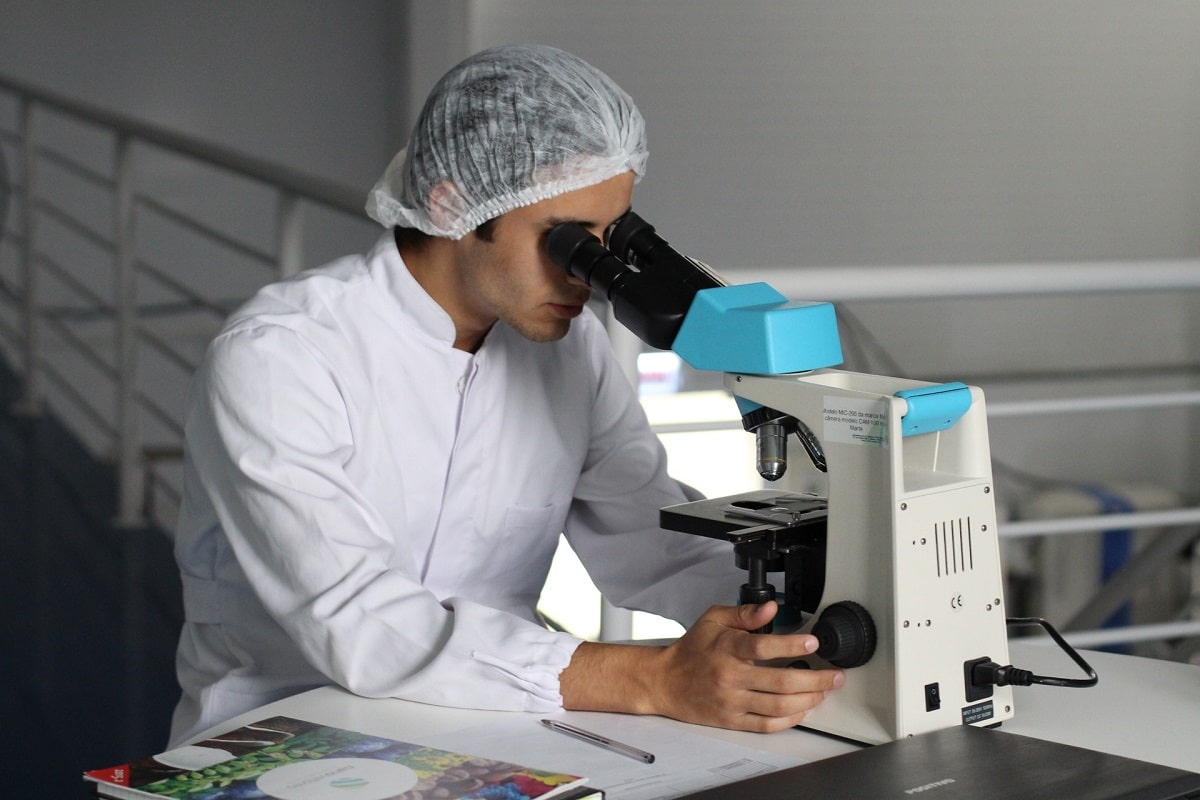 A doctor checking samples in microscope