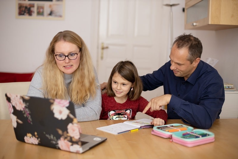 Parents learning together with their child during homeschooling