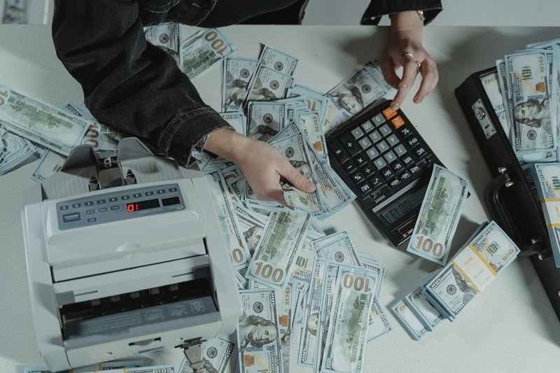 Manager Calculating Money